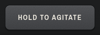 The HOLD TO AGITATE key on the tank
