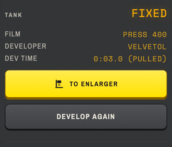 The fixed tank plate: the recipe it ran, the amber TO ENLARGER key, and DEVELOP AGAIN under it